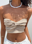 Strapless top Twist front detail Gathered bust Inner silicone strip at bust Shirred back Zip fastening at back Stretch at back Partially lined  