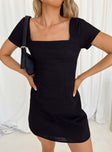 Front view of model wearing  front Princess Polly Square Neck  Hastings Mini Dress Black