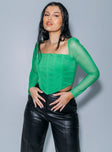 side view of model wearing Princess Polly Beverly Long Sleeve Top Green Full Sleeves Square Neck 