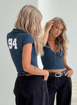 back view of model wearing Princess Polly 94 Kicker Zip Top Navy Short Sleeves Plunger 