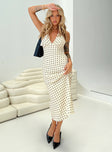 side view of model wearing Princess Polly Kimbelle Halter Maxi Dress Cream / Polka Dot Plunger 