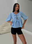 front view of model wearing Princess Polly Full House Tie Up Blouse Top Blue Plaid Half Sleeves Crew Neck 