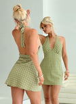 back view of model wearing Princess Polly Kopra Halter Mini Dress Green Plunger 