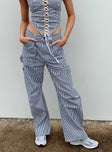 Front view of model wearing  front Princess Polly Low Rise Pants  Miami Vice Pants Navy Pinstripe