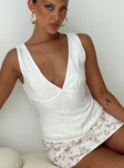 front view of model wearing Princess Polly Solandria Top White Sleeveless V-Neck 