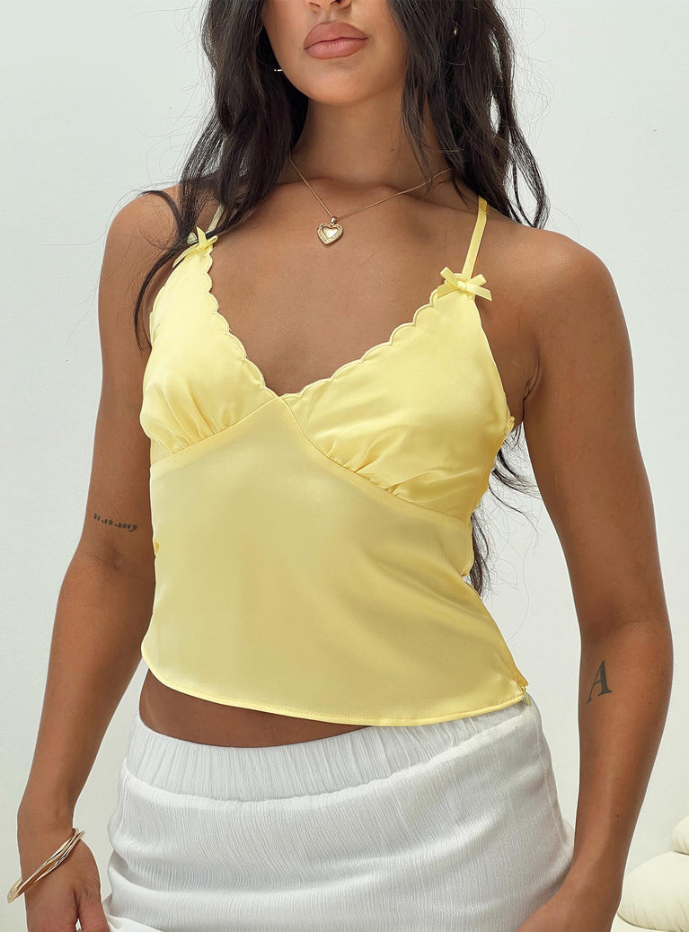 back view of model wearing Princess Polly Satina Top Yellow Sleeveless V-Neck 