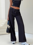 back view of model wearing Princess Polly Archie Low Rise Pants Black Tall Mid Rise 