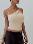 front view of model wearing Princess Polly Catalyst Asymmetrical Top Cream Sleeveless Asymmetric Neckline 