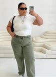 Front view of model wearing  front Princess Polly High Waisted  Holly Asymmetric Straight Leg Jean Green Denim Curve