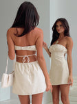 back view of model wearing Princess Polly Luvstruck Strapless Mini Dress Beige Straight Neck 