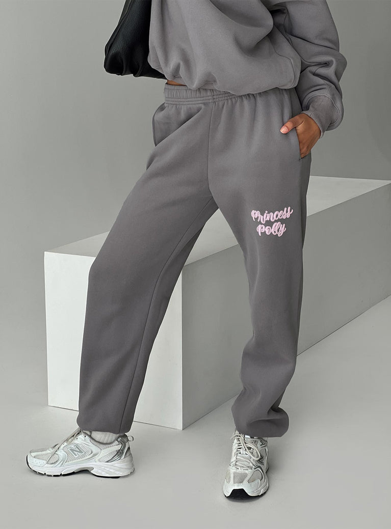 back view of model wearing Princess Polly Princess Polly Track Pants Puff Text Charcoal 