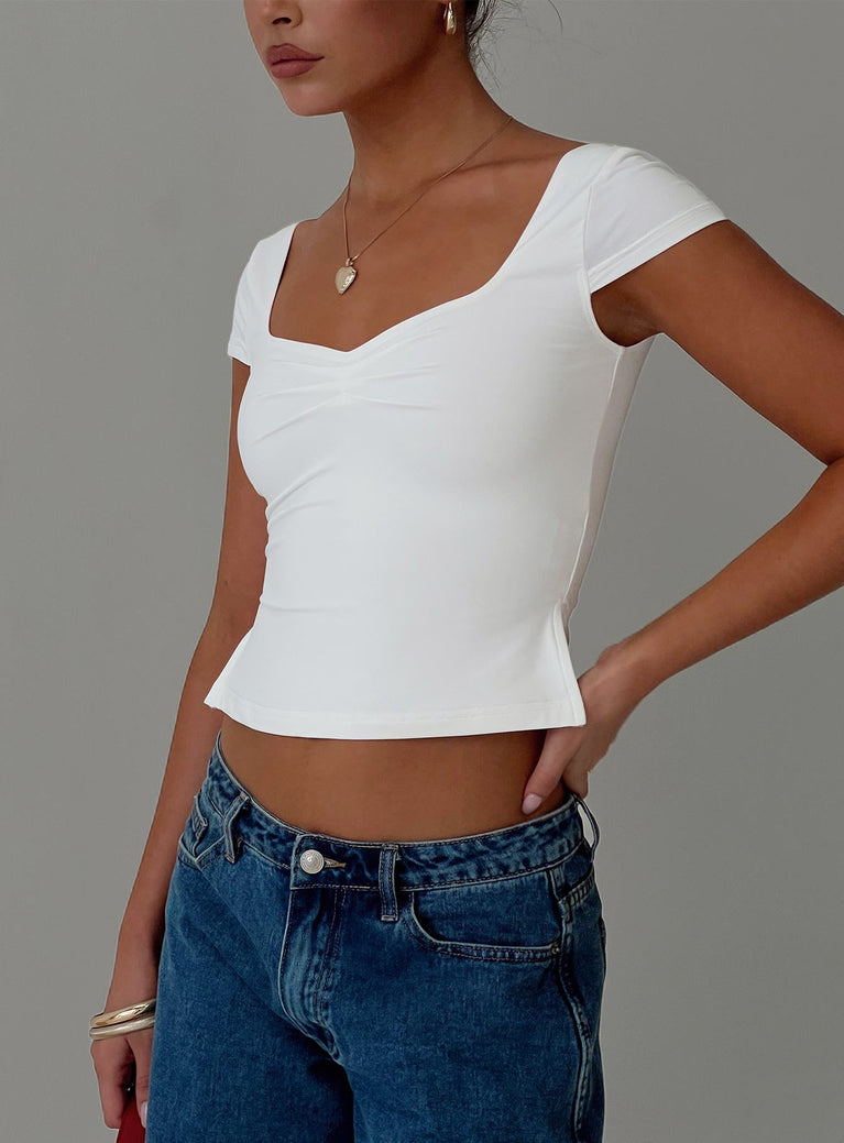 front view of model wearing Princess Polly Rehna Short Sleeve Top White Short Sleeves V-Neck 