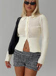 back view of model wearing Princess Polly Ethanne Knit Cardigan Cream Cropped 