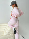 side view of model wearing Princess Polly Princess Polly Track Pants Script Baby Pink / Grey Mid Rise 