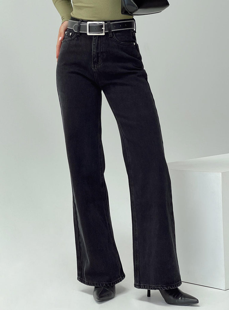 side view of model wearing Princess Polly Maple Flare Jeans Washed Black High Waisted 