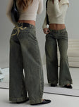 back view of model wearing Princess Polly Ribbon Stamp Wide Leg Jeans Antique Wash Petite Low Rise Jeans 