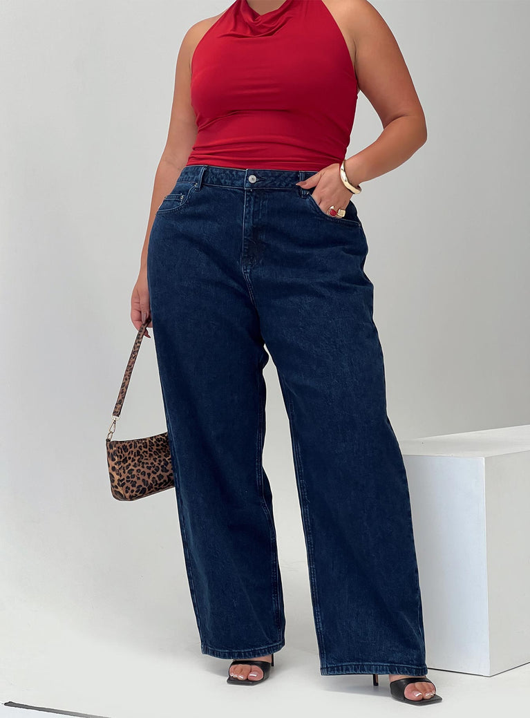 side view of model wearing Princess Polly Britta Mid Rise Tapered Leg Jeans Dark Wash Curve High Waisted 