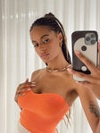 side view of model wearing Princess Polly Alima Strapless Top Orange 