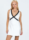 Front view of model wearing  front Princess Polly V-Neck V-Neck  Yaralla Mini Dress White / Black