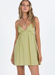 Front view of model wearing  front Princess Polly Asymmetric Neckline  Koko Mini Dress Matcha Green