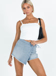 Front view of model wearing  front Bowden Skort Light Wash Denim Princess Polly High Waisted Shorts 