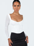 Front view of model wearing  front Princess Polly Full Sleeves Square Neck  Bruna Top Long Sleeve White