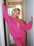 side view of model wearing Princess Polly Ritu Oversized Hoodie Pink Long 