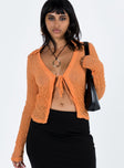 Orange long sleeve top Sheer mesh material  Wide v neckline  Tie front fastening  Good stretch  Unlined 