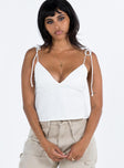 front view of model wearing Princess Polly Brearley Top White Sleeveless Plunger 