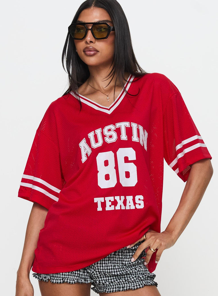 front view of model wearing Princess Polly Austin Texas Sports Jersey Top Red Half Sleeves V-Neck 