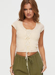 front view of model wearing Princess Polly Fincher Lace Up Top Cream Short Sleeves Scoop Neck 