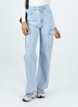 Front view of model wearing  front Princess Polly Mid Rise  Pimaga Wide Leg Cargo Jeans Light Wash Denim