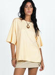 Front view of model wearing  front Princess Polly Half Sleeves High Neck  Sunset Spirit Oversized Tee Cream