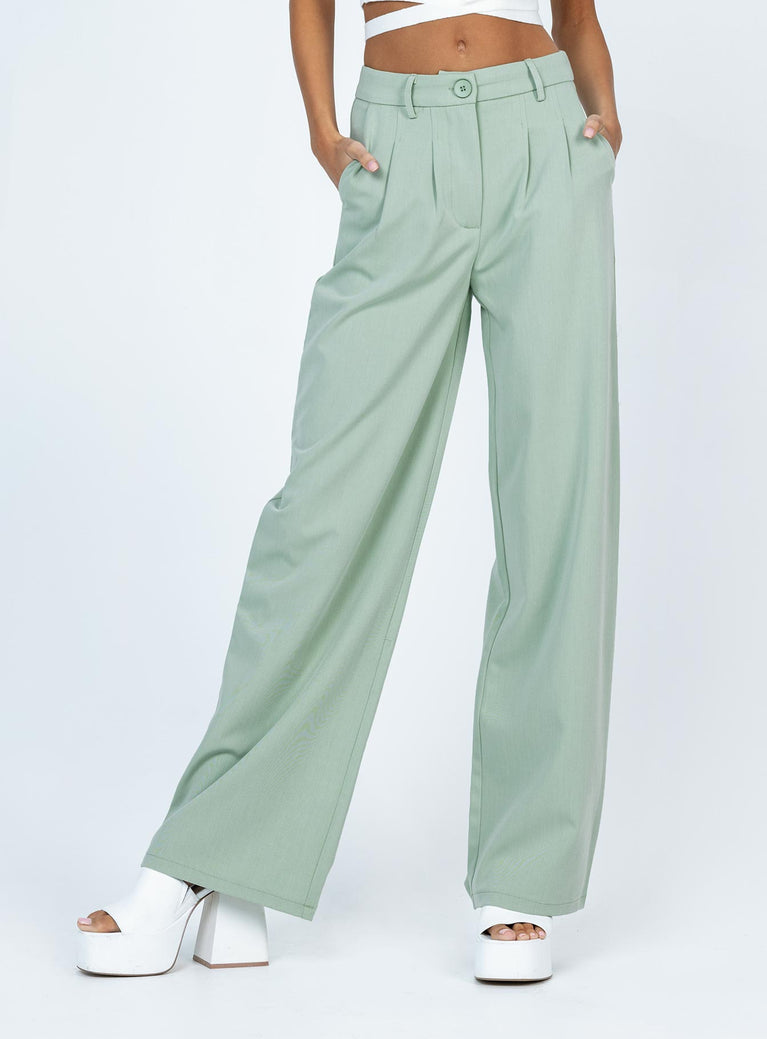 front view of model wearing Princess Polly Archer Pants Green 