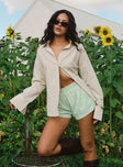 front view of model wearing Princess Polly Beach House Shorts Green Stripe High Waisted Shorts 