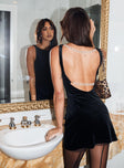 back view of model wearing Princess Polly Fellaire Low Back Mini Dress Black Boat Neck 