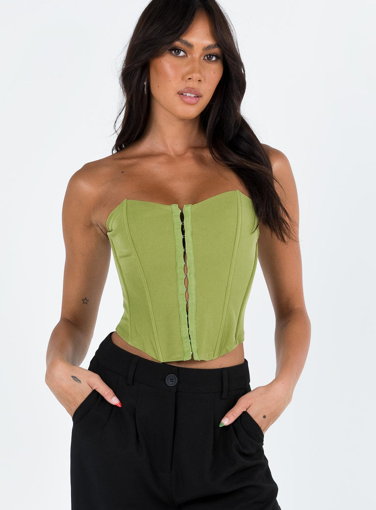 Front view of model wearing  front Princess Polly Sleeveless Square Neck  Archer Corset Top Green