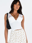 Front view of model wearing  front Princess Polly Sleeveless Square Neck  Typha Top White