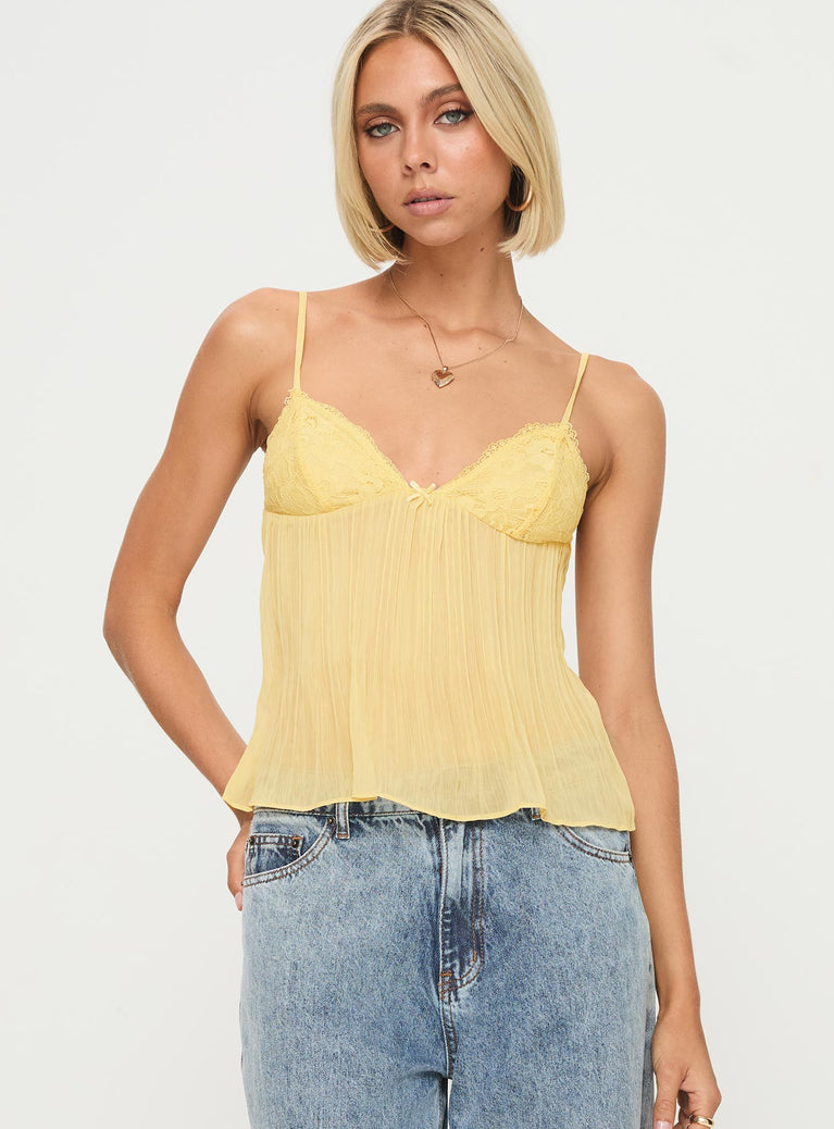 front view of model wearing Princess Polly Zami Pleat Top Lemon Sleeveless Plunger 