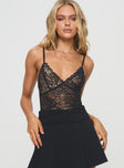 side view of model wearing Princess Polly Enchanta Lace Bodysuit Black Sleeveless Plunger 