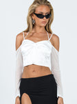 Front view of model wearing  front Princess Polly Sleeveless Square Neck  Promenade Top Ivory