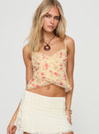 front view of model wearing Princess Polly Niklaus Top Cream Floral Sleeveless V-Neck 