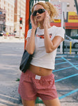 side view of model wearing Princess Polly Cobain Shorts Red Stripe High Waisted Shorts 