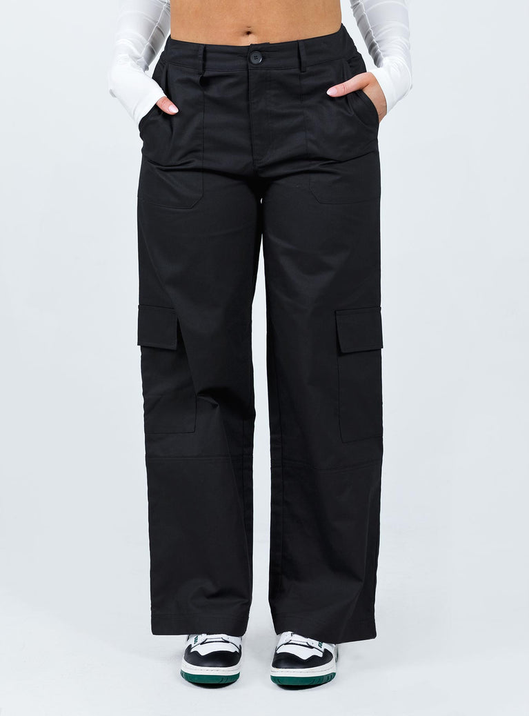 Front view of model wearing  front Princess Polly  Luna Mid Rise Cargo Pants Black