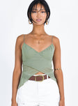 Front view of model wearing  front Princess Polly Sleeveless Sweetheart  Regatta Top Green