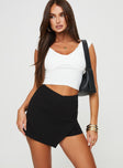 Front view of model wearing  front Maceline Wrap Front Skort Black Princess Polly High Waisted Shorts 