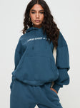 front view of model wearing Princess Polly Princess Polly Hooded Sweatshirt Block / Cursive Text Slate 