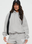 front view of model wearing Princess Polly Princess Polly Hooded Sweatshirt Puff Text Grey 