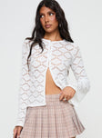 front view of model wearing Princess Polly Streep Crochet Top White Full Sleeves Crew Neck 