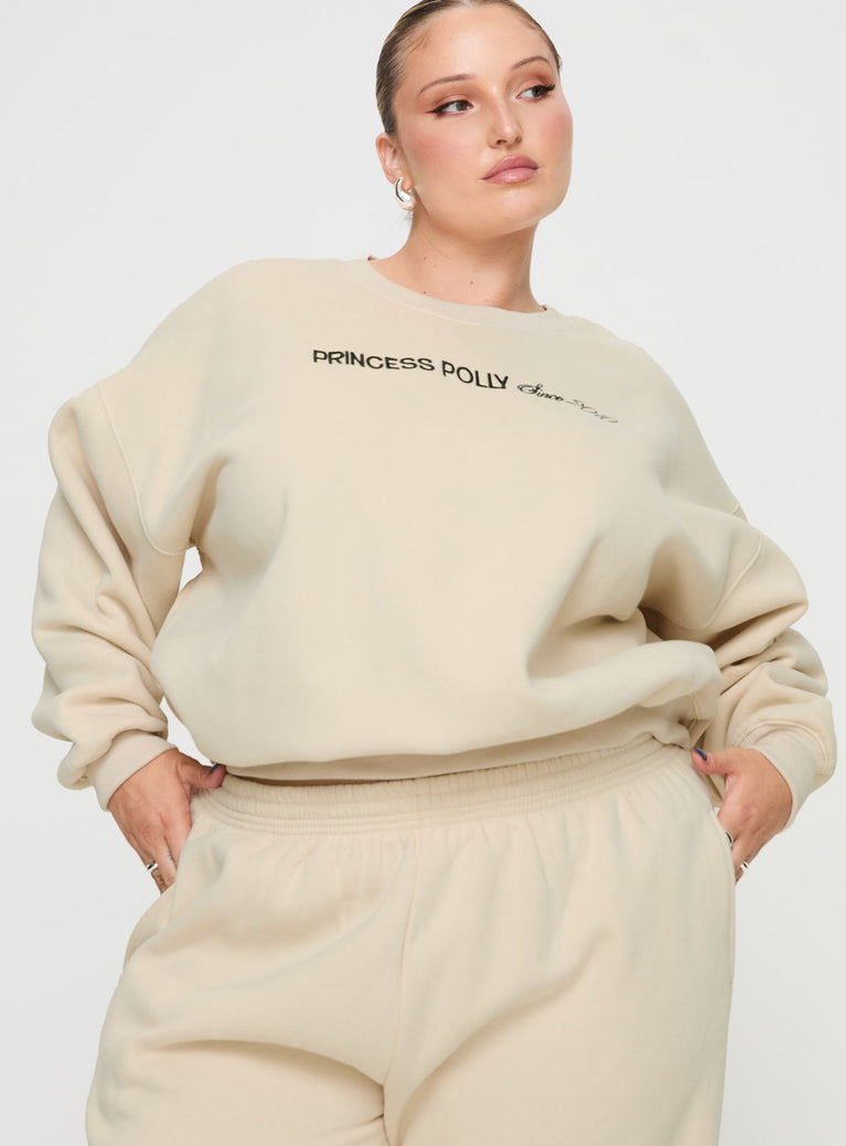 side view of model wearing Princess Polly Princess Polly Crew Neck Sweatshirt Block / Cursive Text Stone Curve regular regular 